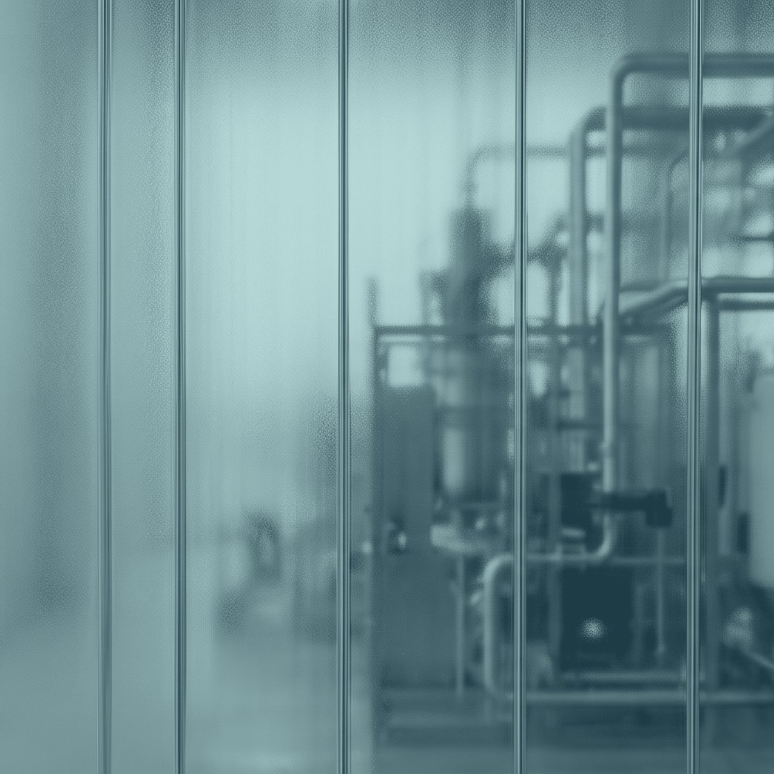 Steel process tanks seen through frosted glass